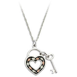 Landstrom's Black Hills Gold Heart and Key Pendant. Sterling Silver Antiqued Heart Pendant with Key. Featuring Beautiful 12K Gold Leaves. Free 18" Rhodium Plated Sterling Silver Chain with purchase of Pendant. Landstrom's - The Original Black Hills Gold, Since 1878.