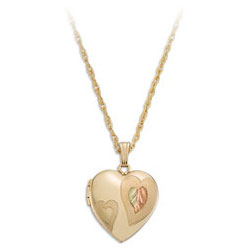 Landstrom's Black Hills Gold Heart Locket.  Wear cherished photos close to your heart. Beautiful 14/20 Gold Filled Heart Locket featuring 12K Gold Trim. Free 18" Gold Filled Chain with purchase of Pendant. Landstrom's - The Original Black Hills Gold, Since 1878.