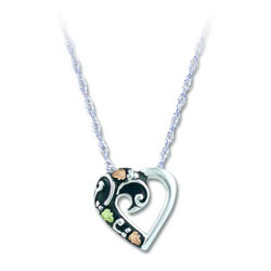 Landstrom's Black Hills Gold Heart Design Pendant. Sterling Silver Pendant featuring Beautiful 12K Gold Leaves. Free 18" Rhodium Plated Sterling Silver Chain with purchase of Pendant. Landstrom's - The Original Black Hills Gold, Since 1878.
	
