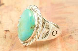 Genuine Manassa Turquoise set in Sterling Silver Ring. This Turquoise is also referred to as King�s Manassa Turquoise. The Manassa Turquoise mine is located in Manassa, Conejos County, Colorado. Created by Navajo Artist Tony Garcia. Signed by the artist.