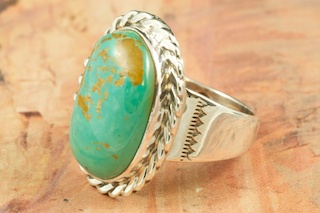 Genuine Manassa Turquoise set in Sterling Silver Ring. This Turquoise is also referred to as King�s Manassa Turquoise. The Manassa Turquoise mine is located in Manassa, Conejos County, Colorado. Created by Navajo Artist Tony Garcia. Signed by the artist.