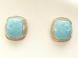 Genuine Number 8 Mine Turquoise Stones set in Sterling Silver French Wire Earrings. The Number 8 mine is located in Eureka County Nevada. Since 1976 there has been no Number 8 Turquoise mined. There is however, an existing stock pile that Mr. Dowell Ward, the last owner of the Number 8 mine, had stocked away for later sorting. The Turquoise is a collector's item--because once the reserve is gone there will be no more material released onto the market. The Gold Mining Company owns the claim to the Number 8 mine and it has been swallowed up by the gold mining operations. This is some of the last Number 8 Turquoise to be had and will be a great addition to your collection. Created by Navajo Artist Emerson Delgarito. Signed.