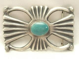 Authentic Native American Jewelry. Genuine Turquoise Stone set in Sandcast Sterling Silver. Signed by the Navajo Artist MC. 