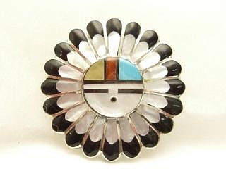 Genuine Mother of Pearl, Black Jade, Turquoise and Coral inlaid between ribons of Sterling Silver. Beautiful Zuni Sunface Brooch. May also be worn as pendant. Created by Zuni Artists Verdell and Esther Niiha. Signed.