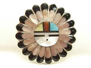 Genuine Pink Mother of Pearl, Black Jade, Turquoise and Coral inlaid between ribons of Sterling Silver. Beautiful Zuni Sunface Brooch. May also be worn as pendant. Created by Zuni Artists Verdell and Esther Niiha. Signed.
