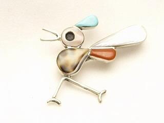 Genuine Turquoise, Mother of Pearl, Coral and Jet set in Sterling Silver. Road Runner Brooch can also be worn as a pendant. Created by a member of the Zuni Tribe.