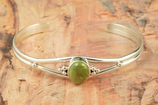 Genuine Crow Springs Turquoise set in Sterling Silver Bracelet. The Crow Springs Mine is located near Tonopah, Nevada. Created by Navajo Artist Larson Lee. Signed by the artist.