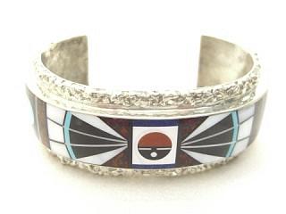 Authentic Native American Jewelry. Stunning Zuni Bracelet with Genuine Mother of Pearl, Turquoise, Coral and Jet inlaid in Sterling Silver. Beautiful Silver Work in this heavy gauge Sterling Silver Bracelet. Created by Zuni Artist James Eoalio. Signed.