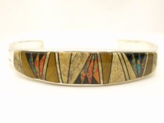 Genuine Picture Jasper, Tigers Eye, Crazy Horse and Black Jade inlaid in Sterling Silver. Stunning Sterling Silver Bracelet. Created by Navajo Artist Calvin Begay. Signed.

