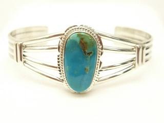 Genuine Manassa Turquoise set in Sterling Silver Bracelet. This Turquoise is also referred to as King�s Manassa Turquoise. The Manassa Turquoise mine is located in Manassa, Conejos County, Colorado. Created by Navajo Artist Larson Lee. Signed.