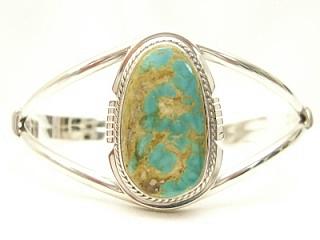 Genuine Crow Springs Turquoise set in Sterling Silver Bracelet. The Crow Springs Mine is located near Tonopah, Nevada. Created by Navajo Artist Phillip Sanchez. Signed. 