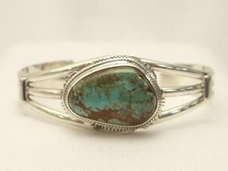 Genuine Crow Springs Turquoise set in Sterling Silver Bracelet. The Crow Springs Mine is located near Tonopah, Nevada. Created by Navajo Artist Larson Lee. Signed.