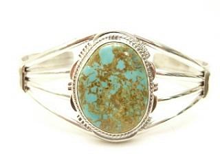 Genuine Manassa Turquoise set in Sterling Silver Bracelet. This Turquoise is also referred to as King�s Manassa Turquoise. The Manassa Turquoise mine is located in Manassa, Conejos County, Colorado. Created by Navajo Artist Margaret Platero. Signed.