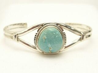 Genuine Royston Turquoise set in Sterling Silver Bracelet. The Royston Turquoise Mine was originally known as the Royal Blue Mine. It produces Turquoise that has a mixture of blues and greens in the same formation. The Royston Turquoise Mine is located in Nye County, Nevada. Created by Navajo Artist Arkie Nelson.