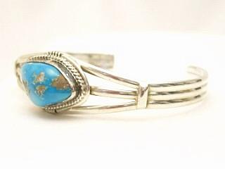 Genuine Blue Ridge Turquoise set in Sterling Silver Bracelet. The Blue Ridge Turquoise Mine is located in Lander County County, Nevada. Created by Navajo Artist Kathy Yazzie. Signed.
