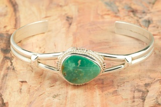 Genuine Dry Creek Turquoise set in Sterling Silver Bracelet. The Dry Creek Mine is located near Battle Mountain, Nevada. Dry Creek Turquoise forms when there are no heavy metals present such as copper or iron. To date, no other vein of this Turquoise has been discovered anywhere else other than the Dry Creek Mine and when this vein runs out, that will be the last of it. Because this Turquoise is as rare as the sacred buffalo, the Indians call it 