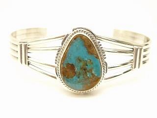 Genuine Manassa Turquoise set in Sterling Silver Bracelet. This Turquoise is also referred to as King�s Manassa Turquoise. The Manassa Turquoise mine is located in Manassa, Conejos County, Colorado. Created by Navajo Artist Larson Lee. Signed.