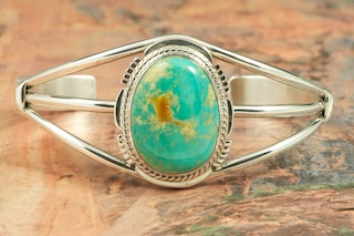 Genuine Manassa Turquoise set in Sterling Silver Bracelet. This Turquoise is also referred to as King�s Manassa Turquoise. The Manassa Turquoise mine is located in Manassa, Conejos County, Colorado. Created by Navajo Artist Margaret Platero. Signed by the artist.