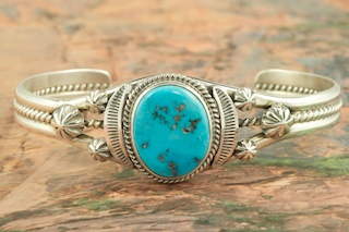 Genuine Sleeping Beauty Turquoise set in Sterling Silver Bracelet. The Sleeping Beauty Turquoise mine is located in Gila County, Arizona. Created by Navajo Artist John Nelson. Signed by the artist.
