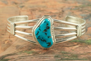 Genuine Sleeping Beauty Turquoise set in Sterling Silver Bracelet. The Sleeping Beauty Turquoise mine is located in Gila County, Arizona. Created by Navajo Artist Larson Lee. Signed by the artist.