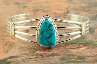 Genuine Sleeping Beauty Turquoise set in Sterling Silver Bracelet. The Sleeping Beauty Turquoise mine is located in Gila County, Arizona. Created by Navajo Artist Larson Lee. Signed by the artist.