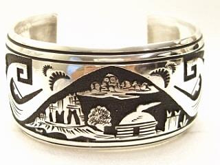 Sterling Silver Bracelet with Storyteller Design. Beautiful overlay technique. Created by Navajo Artist Tommy Singer. Signed 