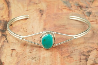 Stunning heavy gauge Sterling Silver Bracelet with Buffalo Designs. Beautiful overlay technique. Created by Navajo Artist Tommy Singer. Signed 