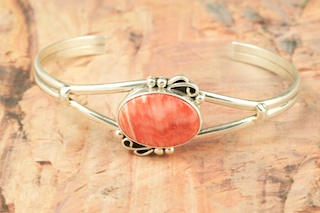 Stunning heavy gauge Sterling Silver Bracelet with Buffalo Designs. Beautiful overlay technique. Created by Navajo Artist Tommy Singer. Signed 
