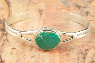Genuine Pilot Mountain Turquoise set in Sterling Silver Bracelet. The Pilot Mountain Mine is located in Esmeralda County, Nevada. Created by Navajo Artist Kathy Yazzie. Signed by the artist.
