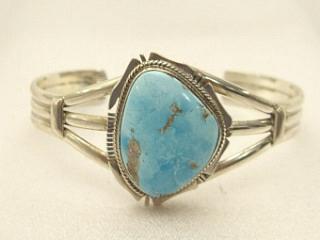 Genuine Morenci Turquoise set in Sterling Silver Bracelet. This Turquoise is highly sought after for its blue colors and iron pyrite, or "fool's gold" matrix. The Morenci Turquoise Mine is located in Greenlee County, Arizona. Created by Navajo Artist Kathy Yazzie. Signed.