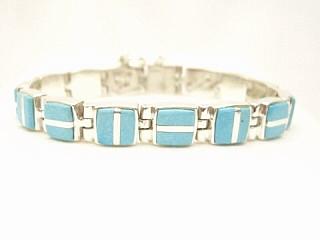 Genuine Sleeping Beauty Turquoise inlaid between ribbons of Sterling Silver.  Stunning Sterling Silver Bracelet. Created by Navajo Artist Marvin Roberts. Signed
