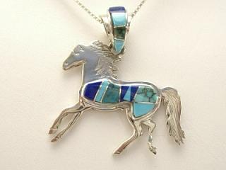 Genuine Sleeping Beauty Turquoise, Blue Lapis and Spider Web Turquoise inlaid between ribbons of Sterling Silver. Precision inlay on the bale and pendant. Free 18