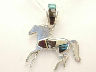 Genuine Tiger Eye, Picture Jasper, Crazy Horse and Black Jade inlaid between ribbons of Sterling Silver. Beautiful inlay work on the bale. Horse Pendant features Fire & Ice Lab Opal accents. Created by Navajo Artist Calvin Begay. 