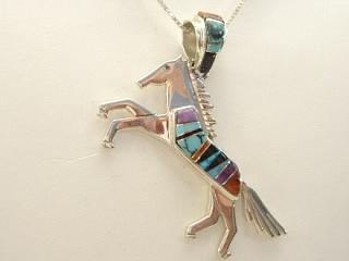 Genuine Spider Web Turquoise, Sugilite, Coral and Jet inlaid between ribbons of Sterling Silver. Large Galloping Horse with inlaid bail. Free 18