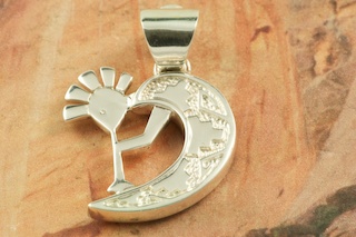 Genuine Sleeping Beauty Turquoise, Blue Lapis, Spiny Oyster Shell, Sugilite and Spider Web Turquoise inlaid between ribbons of Sterling Silver. Kokopelli Sterling Silver Pendant with precision inlay. Free 18