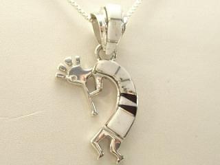 White Buffalo Turquoise and Jet inlaid between ribbons of Sterling Silver. Stunning Kokopelli Pendant. This Beautiful Stone is formed from the mineral Magnesite. It is mined near Elko Nevada. Created by Navajo Artist Calvin Begay. Free 18" Sterling Silver Chain with purchase of pendant. 
