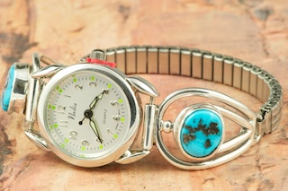 Genuine Sleeping Beauty Turquoise set in Sterling Silver Watch Tips.  Ladies quartz watch with expandable watch band. Created by Navajo Artist Larson Lee. Signed.