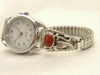 Genuine Coral set in Sterling Silver Watch Tips. Sterling Silver Leaf Design. Ladies quartz watch with expandable watch band. Navajo Made.