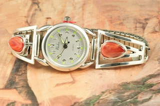 Genuine Copper Jasper set in Sterling Silver Watch Tips. Ladies quartz watch with expandable watch band. Created by Navajo Artist Freddy Charley.