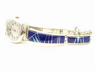 Genuine Blue Lapis inlaid between ribbons of Sterling Silver. Genuine Sleeping Beauty Turquoise Accents. Beautiful Ladies Watch Bracelet Created by Navajo Artist Pamela Daniels. Signed.