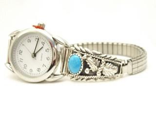 Genuine Sleeping Beauty Turquoise set in Sterling Silver Watch Tips. Ladies quartz watch with expandable watch band. Created by Navajo Artist Thomas Chischilly. Signed.