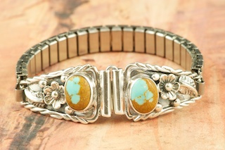 Genuine Number 8 Mine Turquoise set in Sterling Silver. Ladies Watch Tips with expandable band. Created by Navajo Artist Larson Lee.
