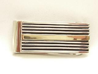 Beautiful Sterling Silver Money Clip with 14K Gold overlay. Created by Navajo Artist Calvin Begay. Signed.
