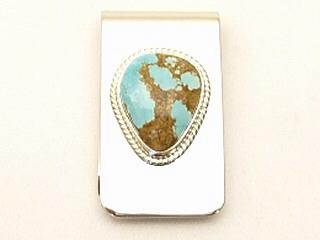 Authentic Native American Jewelry. Beautiful Gold fill Designs on oxidized Sterling Silver set on a Nickel Silver Money Clip. Featuring a Horse, Bear, Rabbit and Kokopelli. Created by Navajo Artist Tommy Singer. 
