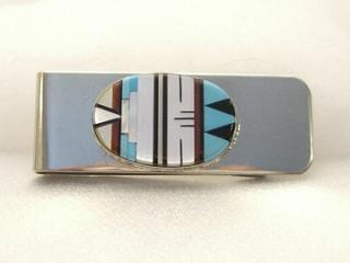 Authentic Native American Jewelry. Genuine Turquoise, Mother of Pearl, Coral and Jet inlaid in Sterling Silver and set on a Nickel Silver Money Clip. Created by Zuni Artist Bernadette Lemintino. Signed.
