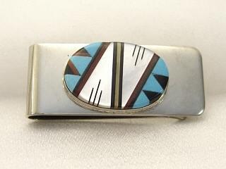 Genuine Turquoise, Mother of Pearl, Coral and Jet inlaid in Sterling Silver and set on a Nickel Silver Money Clip. Created by Zuni Artist Bernadette Lemintino. Signed.
