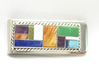Genuine Turquoise, Spiny Oyster Shell, Sugilite and Blue Lapis inlaid in Sterling Silver and set on a Nickel Silver Money Clip. Created by Navajo Artist Arnold Yazzie. Signed Y.