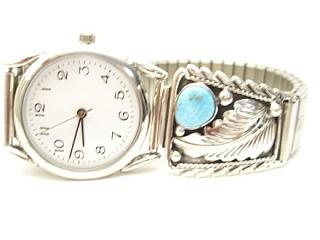 Genuine Sleeping Beauty Turquoise set in Sterling Silver Watch Tips. Sterling Silver Leaf Design. Mens Watch with expandable band. Created by Navajo Artist Thomas Chischilly. Signed.