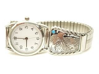 Genuine Sleeping Beauty Turquoise set in Sterling Silver Watch Tips. Sterling Silver Eagle Design. Mens Watch with expandable band. Created by Navajo Artist Thomas Chischilly. Signed.