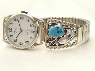 Genuine Sleeping Beauty Turquoise set in Sterling Silver Watch Tips. Men's Watch with an expandable Band. Created by Navajo Artist Thomas Chischilly.